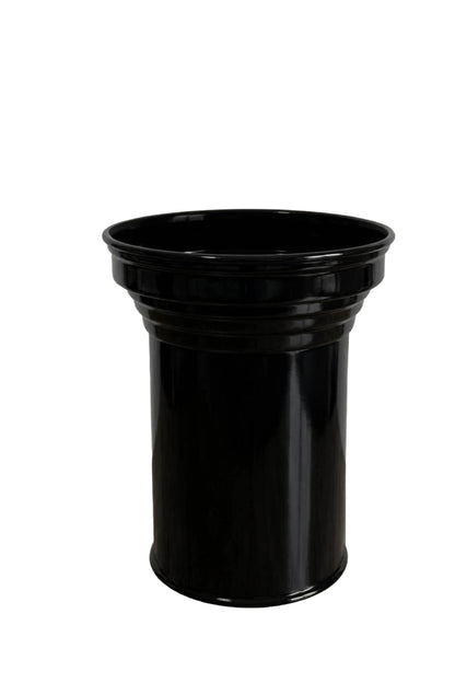 Capital detail of sculptural black metal column table by CASPAL